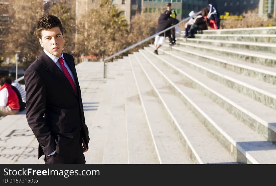 Handsome businessman in urban background