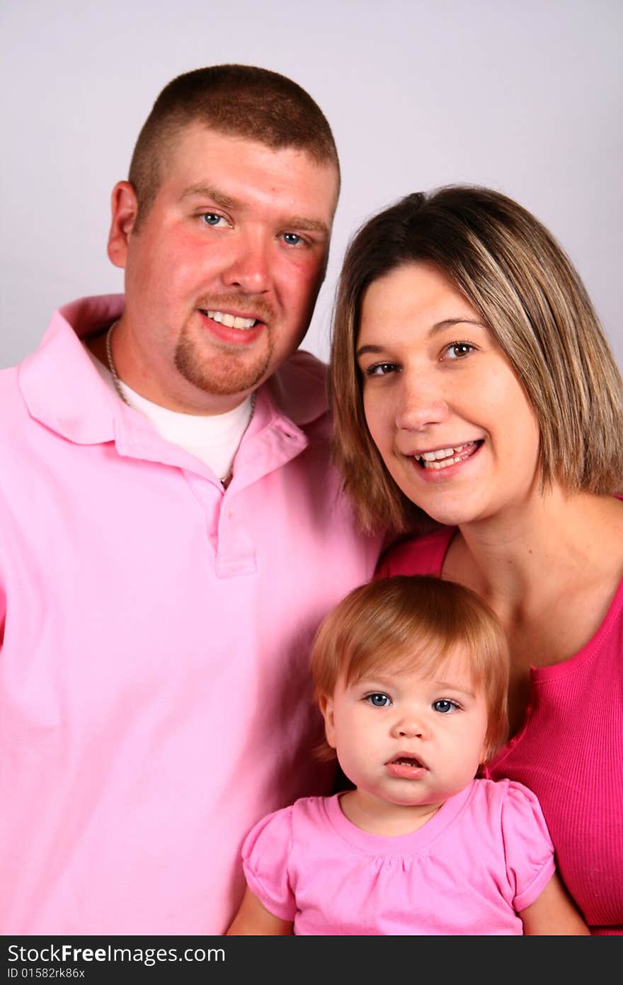 A mother, father and daughter share a happy moment. A mother, father and daughter share a happy moment.