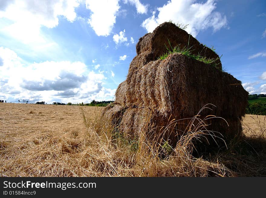 A hay stack on a wide open field in southern Germany