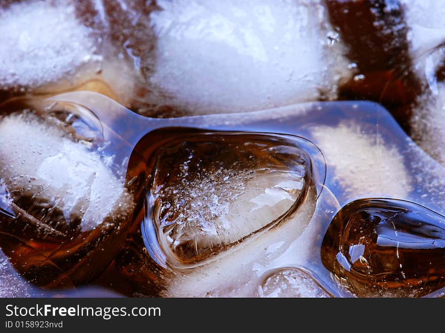 Alcohol drink with ice cube in  cristal glass