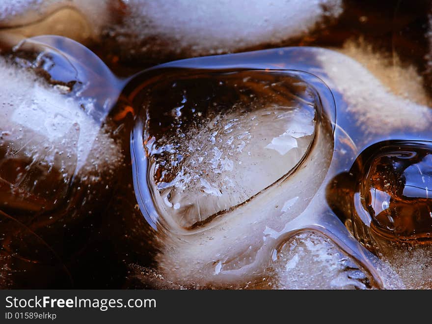 Alcohol drink with ice cube in cristal glass