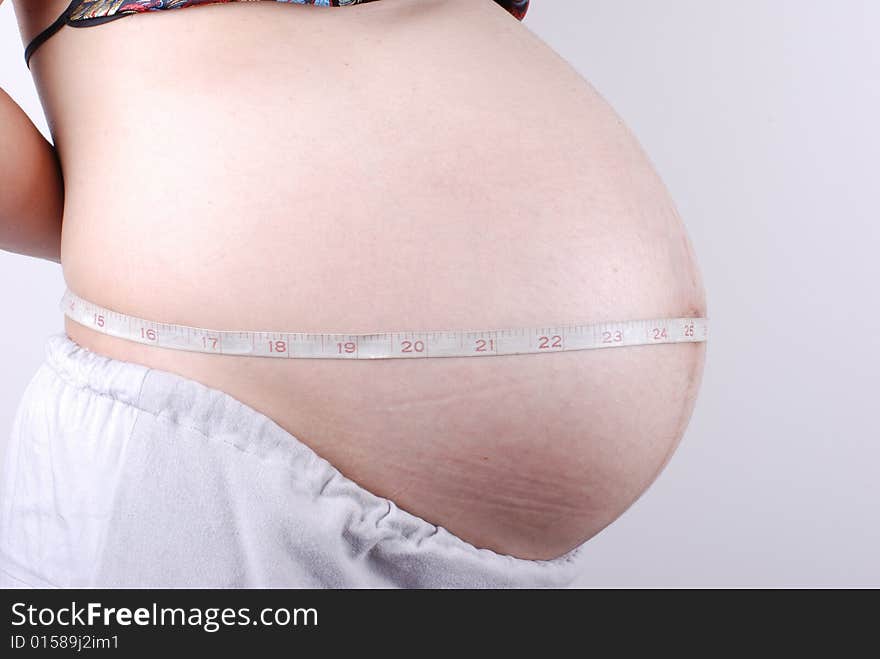 Pregnant woman on white background