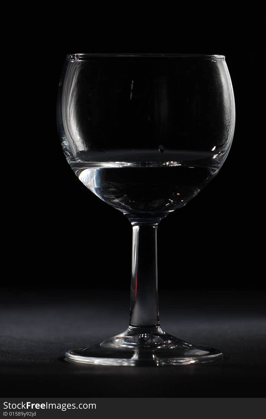 Drinking glass in black background