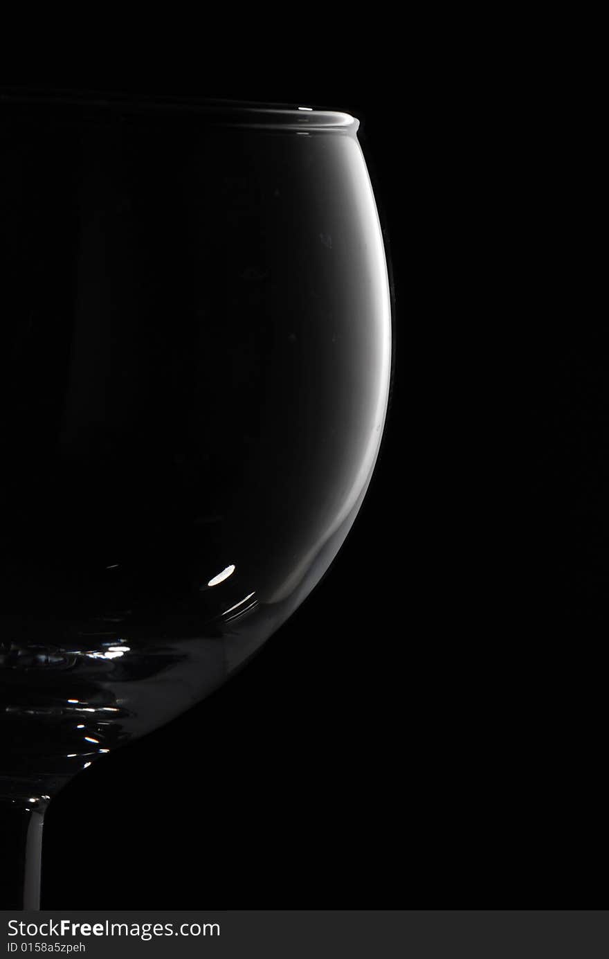 Drinking glass in black background