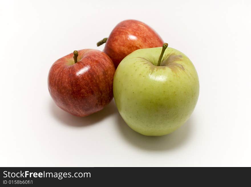 2 red and 1 yellow apple on white background. 2 red and 1 yellow apple on white background