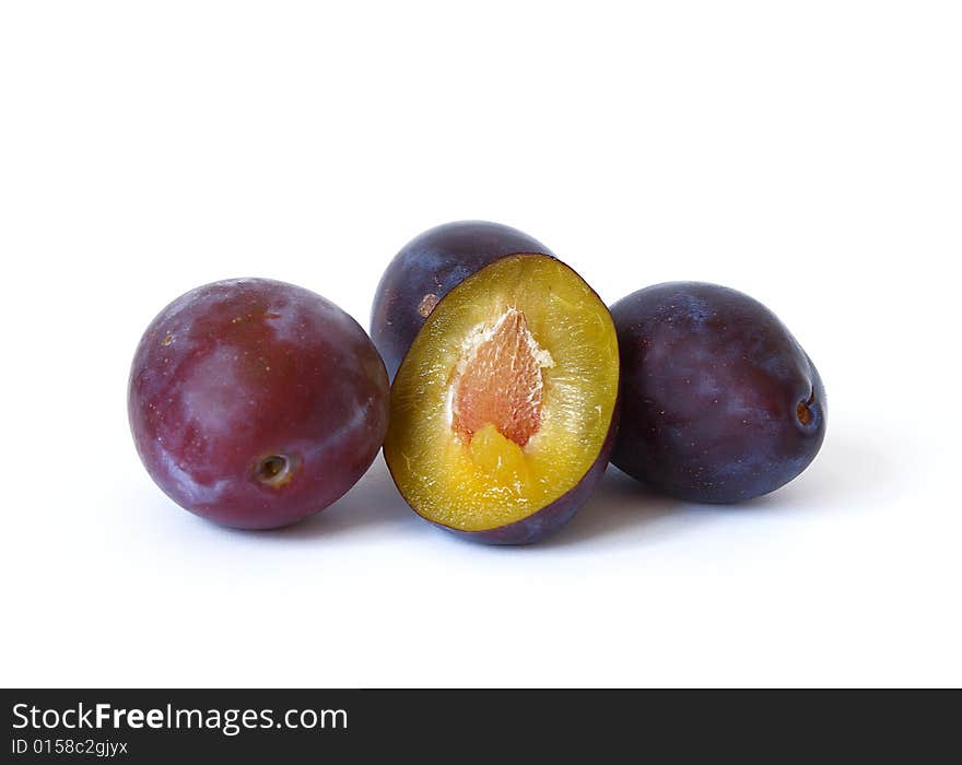 Ripe plums isolated on a white background