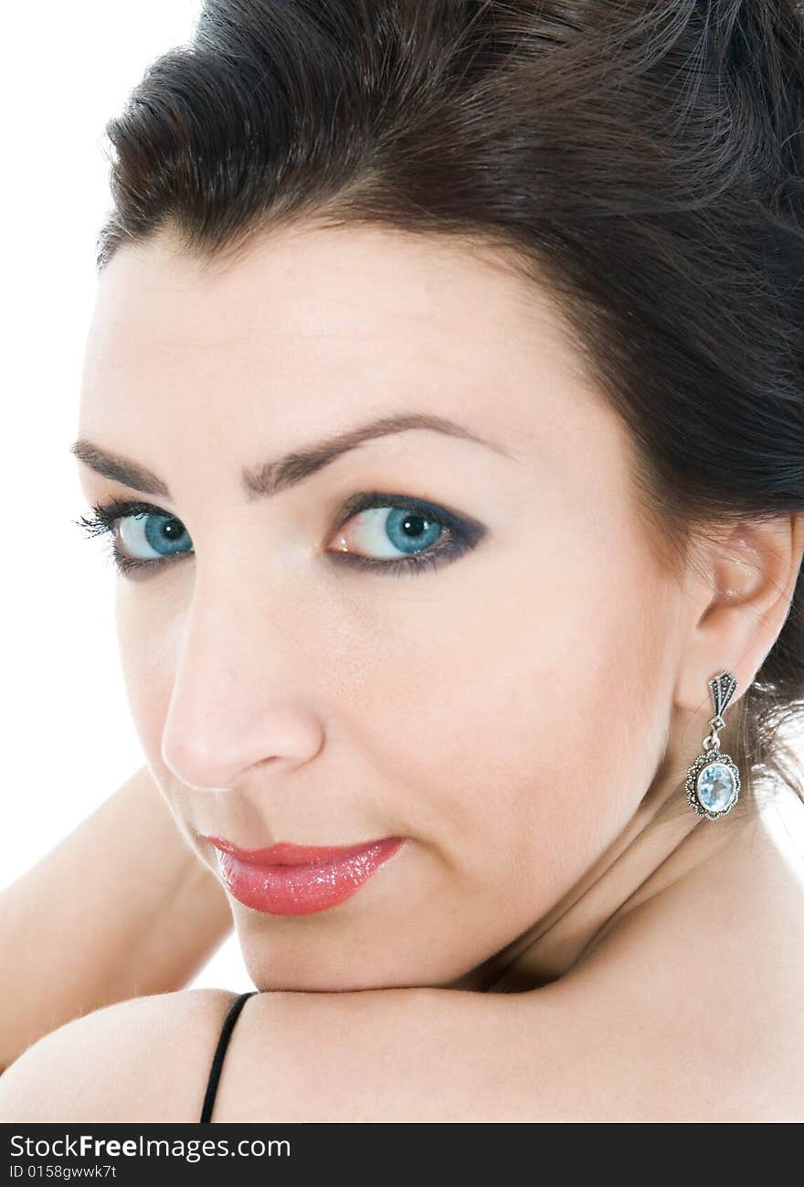 Portrait of the brunette in the evening dress on  isolated background