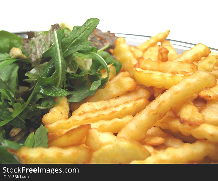 A close-up picture of some chips and a healthy salad