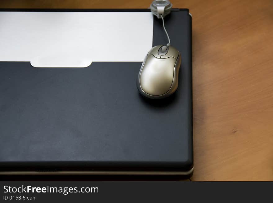 Mouse with laptop on the table. Mouse with laptop on the table