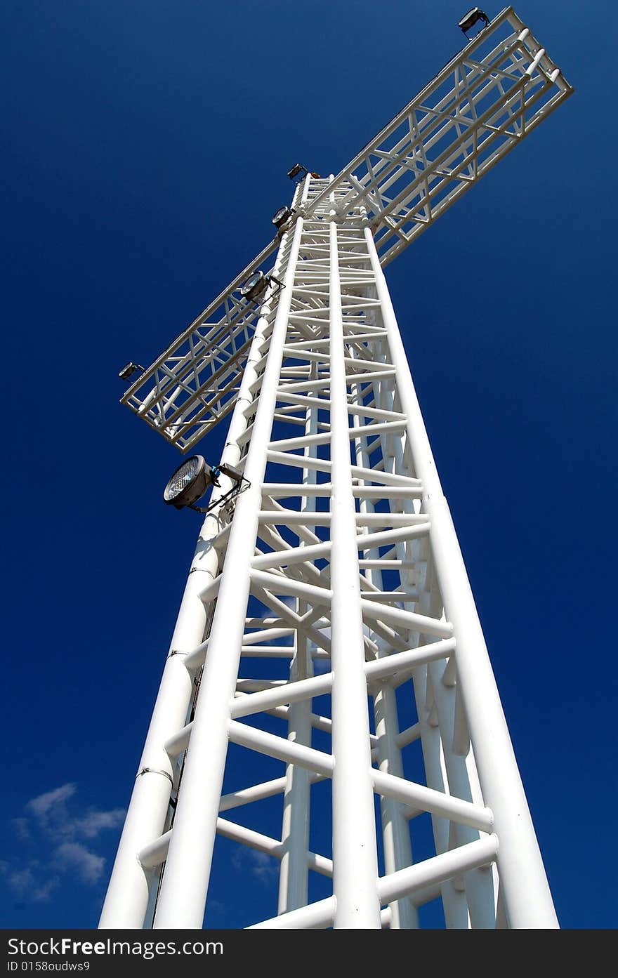 White steel cross on top of the mountain