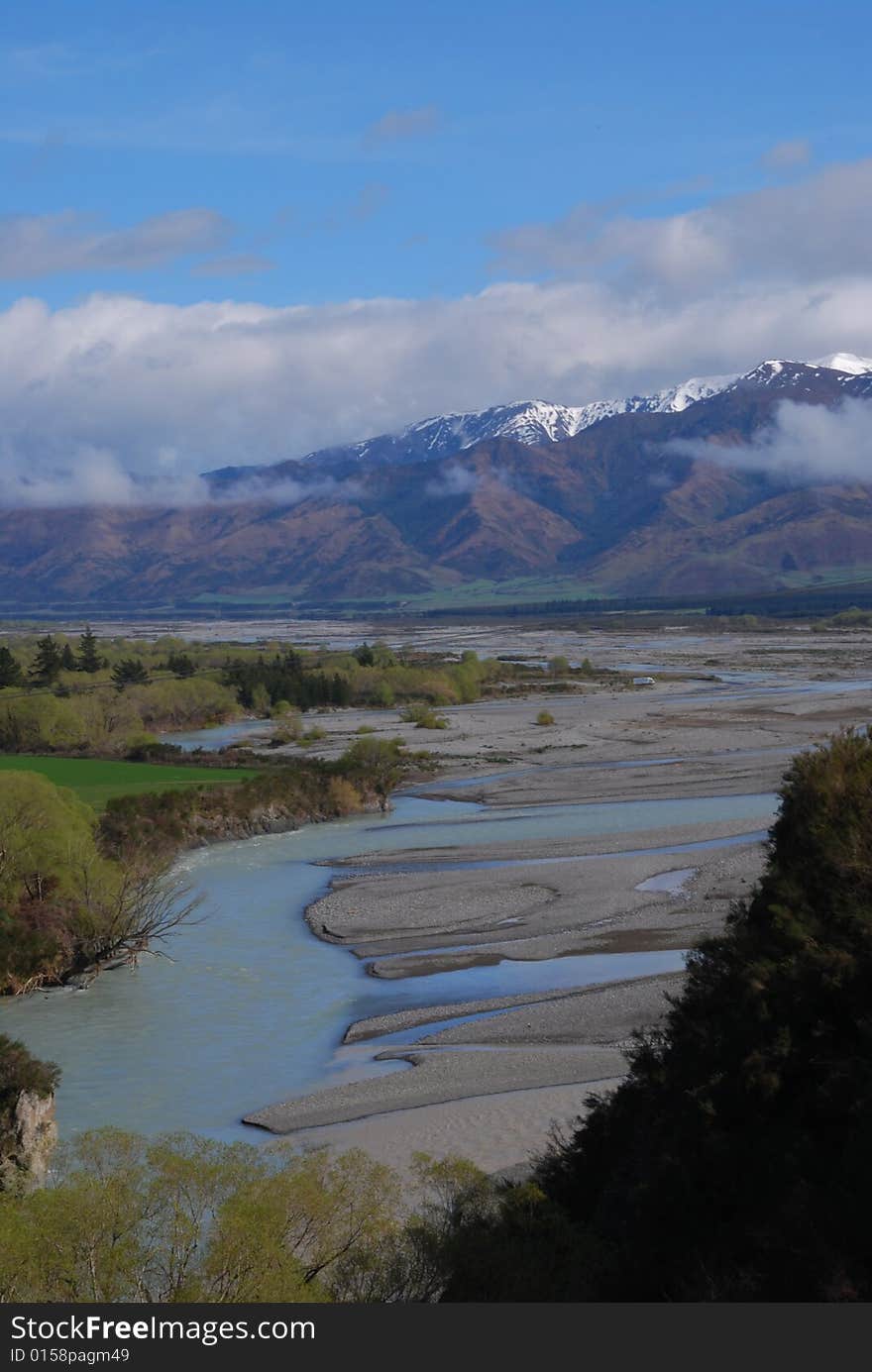 Heavy clouds over the mountain range, winding river. Heavy clouds over the mountain range, winding river.