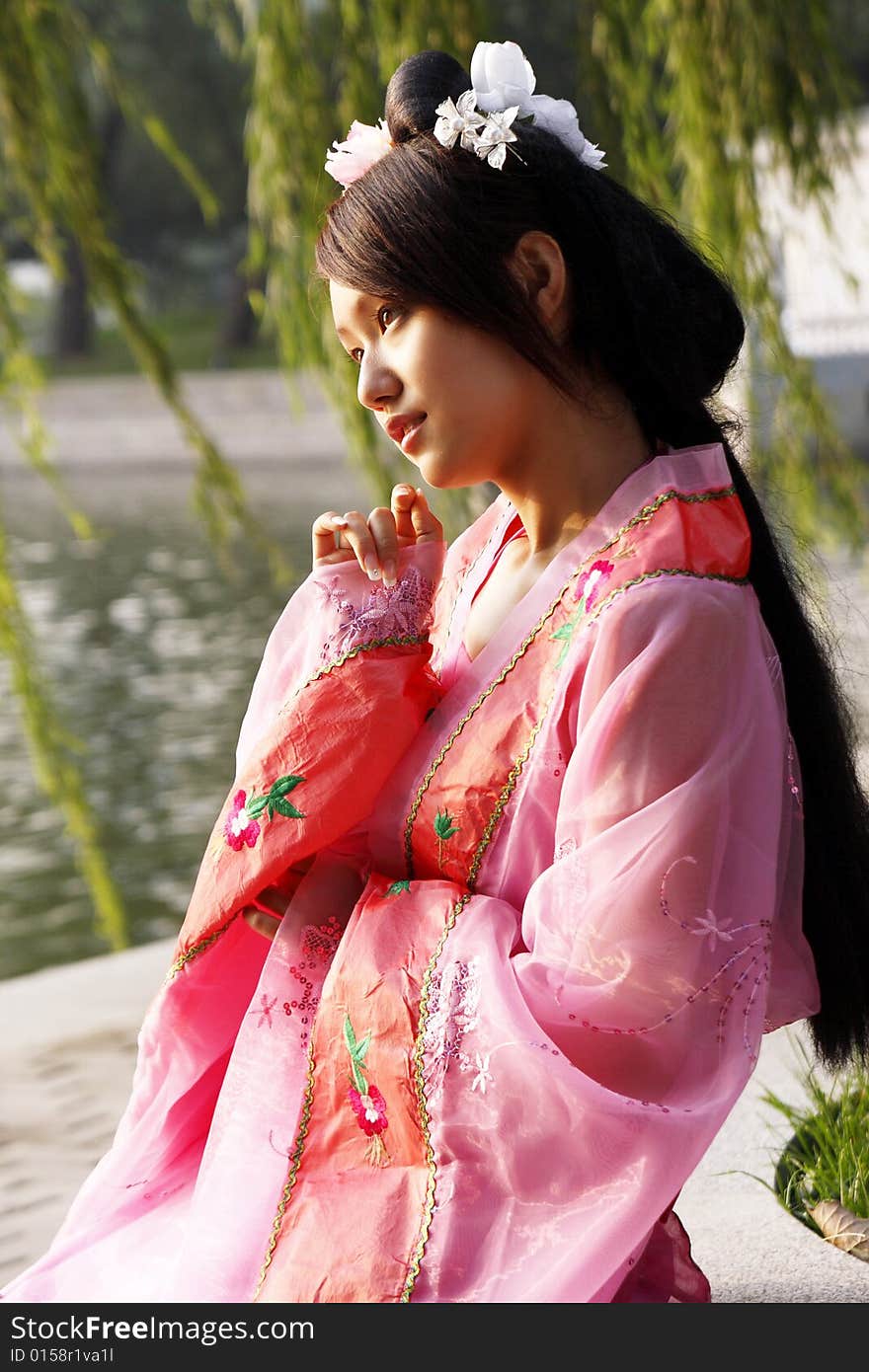 A girl in Chinese ancient dress.She is in pondering . A girl in Chinese ancient dress.She is in pondering ....