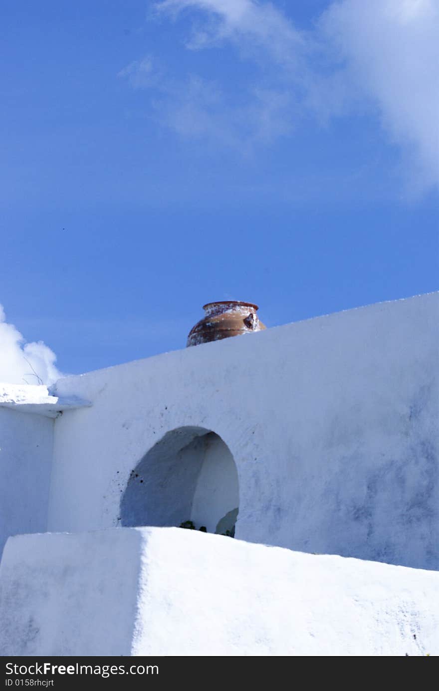 Vase set in whitewashed wall, Folegandros, Greece