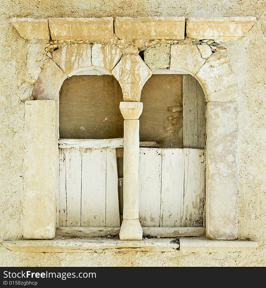 A wall of an old church in Folegandros island, Greece, build-ed with marbles of an ancient temple. A wall of an old church in Folegandros island, Greece, build-ed with marbles of an ancient temple.