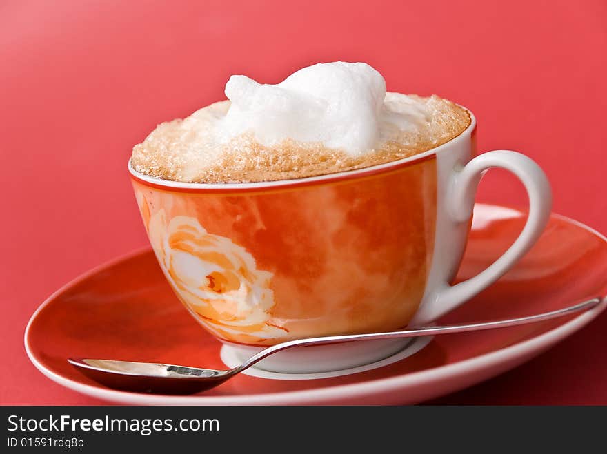 A cup of cappuccino with milk foam