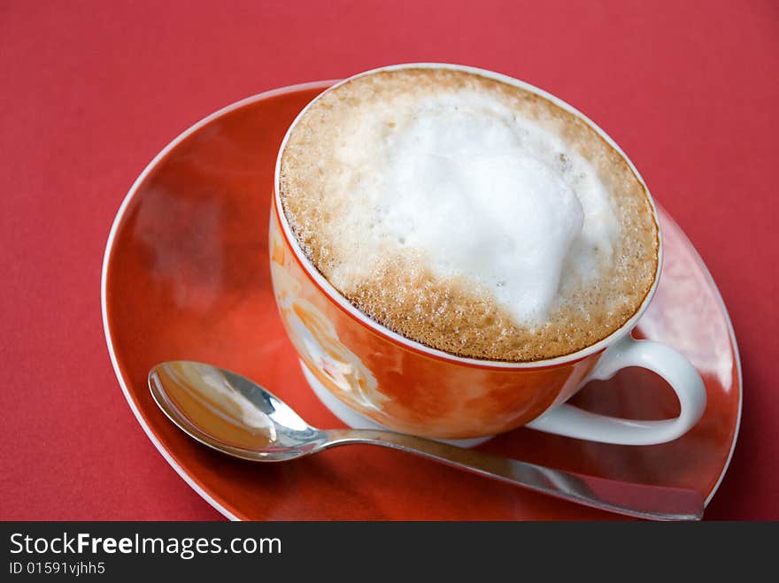 A cup of cappuccino with milk foam