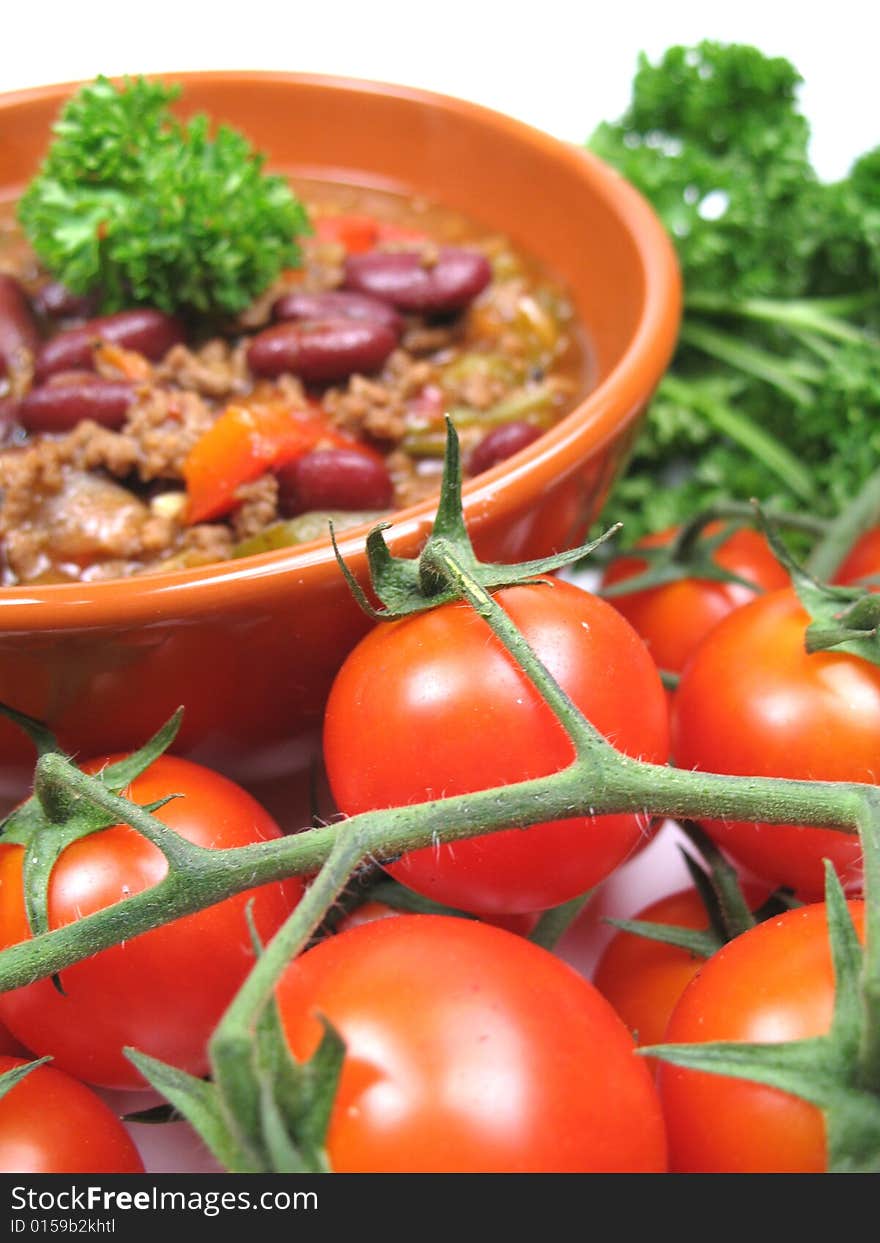 A delicious meal with tomatoes in the foreground. A delicious meal with tomatoes in the foreground