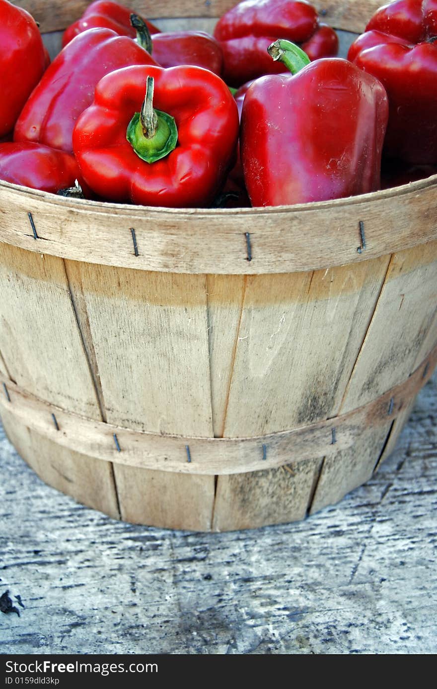 Red peppers in a bushel basket. Red peppers in a bushel basket.