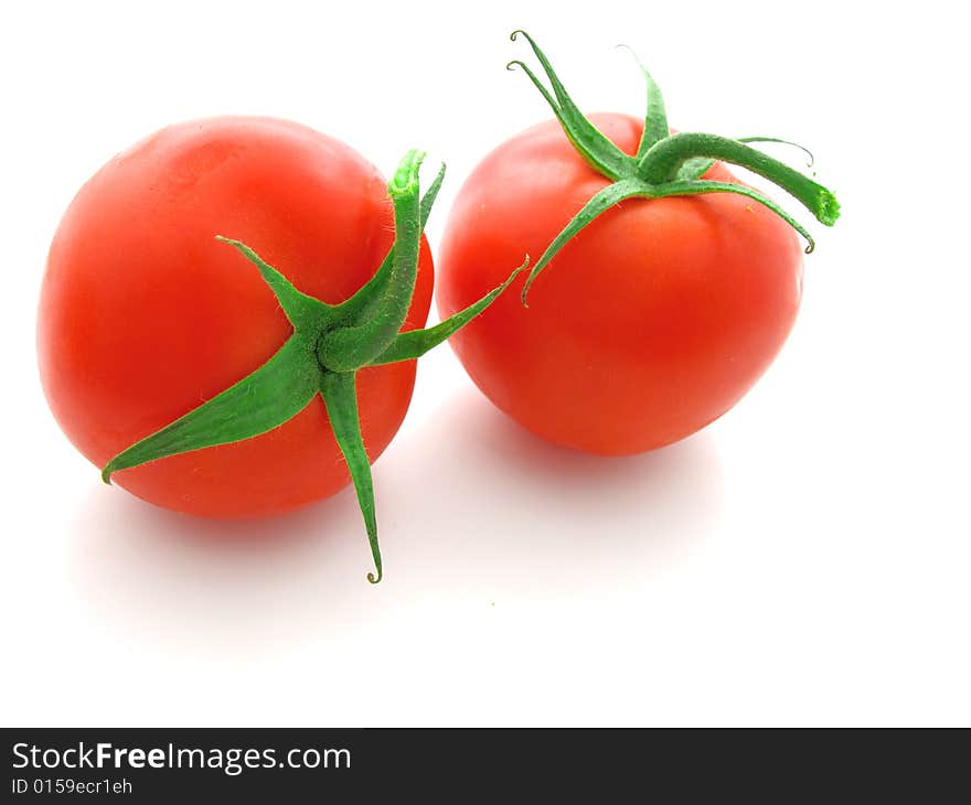 Red tomato isolated on white background.