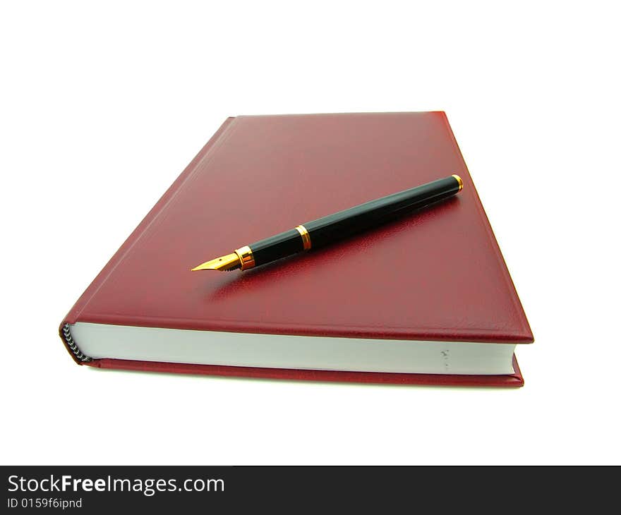 Notebook and pen isolated on a white background.