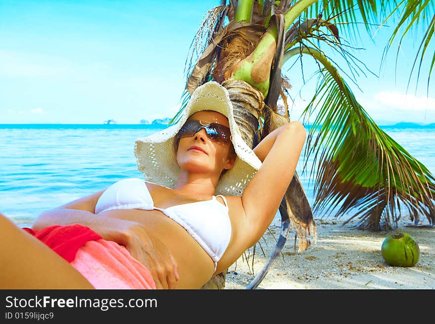 View of nice woman having fun on tropical beach. View of nice woman having fun on tropical beach