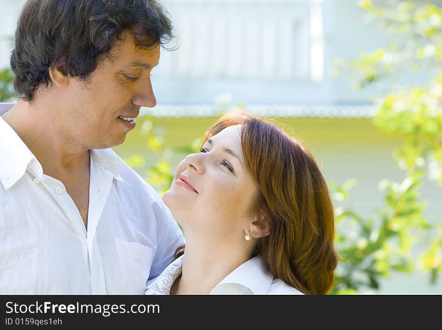 Portrait of young happy couple in summer environment. Portrait of young happy couple in summer environment