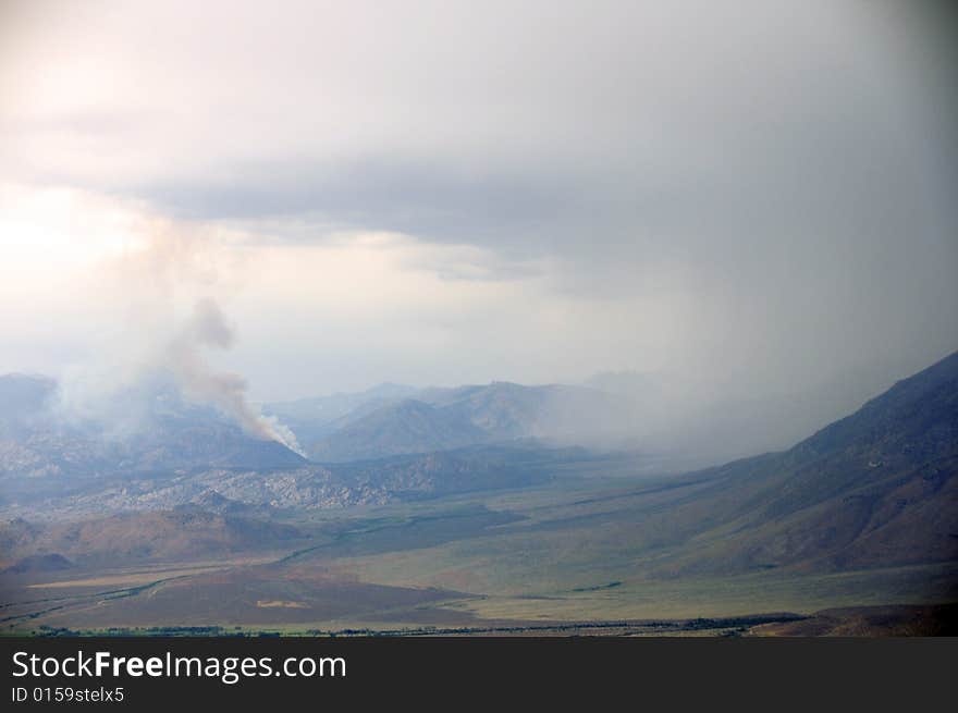 Thunderstorm in the mountains and a wildfire started by a lightning strike