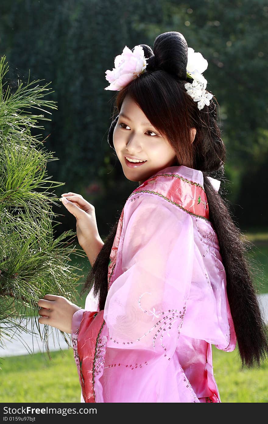 A girl in Chinese ancient dress.She is so beautiful and lovely. A girl in Chinese ancient dress.She is so beautiful and lovely.