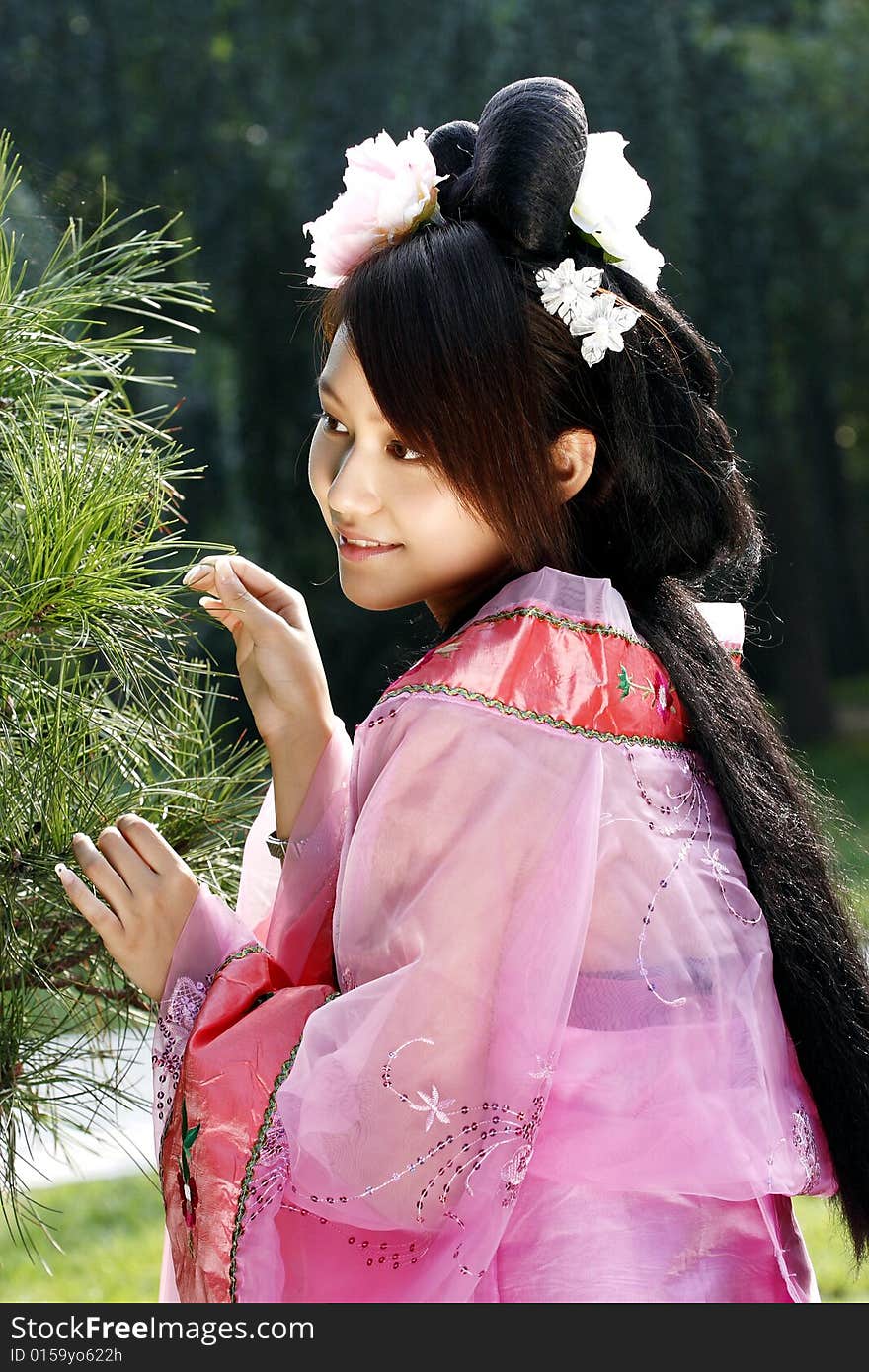 A girl in Chinese ancient dress. She is so beautiful and lovely. A girl in Chinese ancient dress. She is so beautiful and lovely.