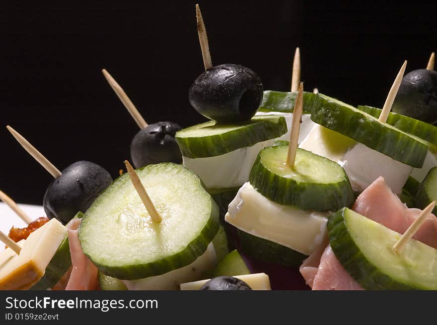 Lot of vegetables, ham and chees on stick. Lot of vegetables, ham and chees on stick