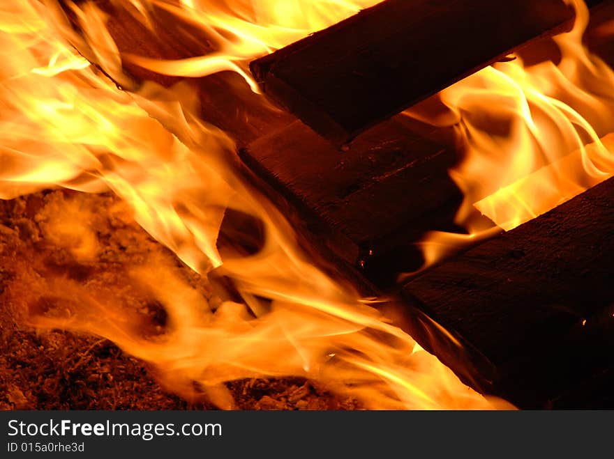 Red beautiful flames in a bonfire. Red beautiful flames in a bonfire