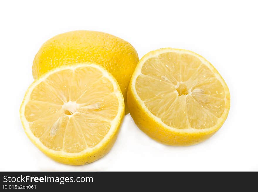 Detail of a sliced lemon on white