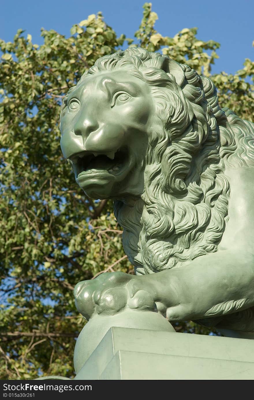 Head of a stone lion on a pedestal