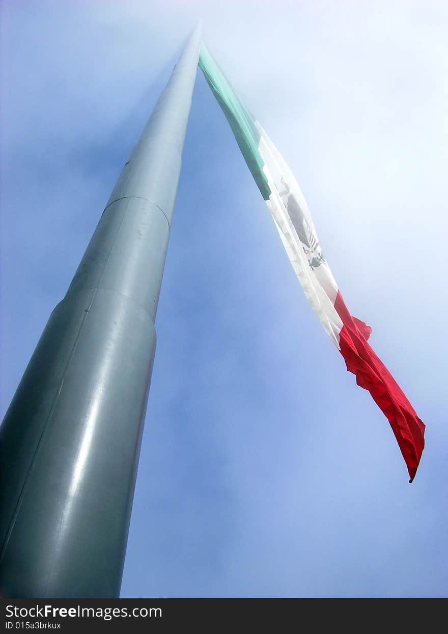 300 feet tall Mexican flag in a foggy sky (Ensenada, Mexico).