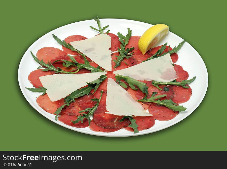 Cold snack - Beef carpaccio with parmesan cheese.