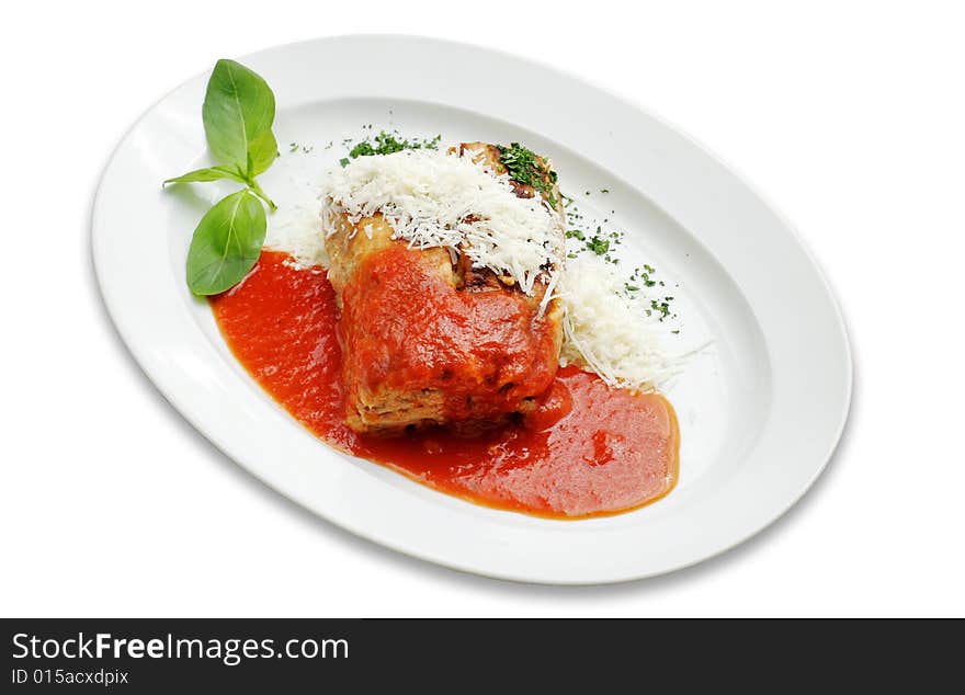 Baked pasta and meat  with sauce and basil leaf on white isolated. Path. Baked pasta and meat  with sauce and basil leaf on white isolated. Path.