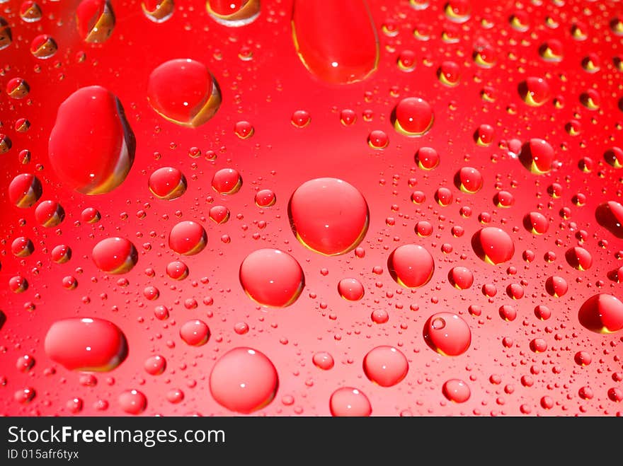 Water drops on red background