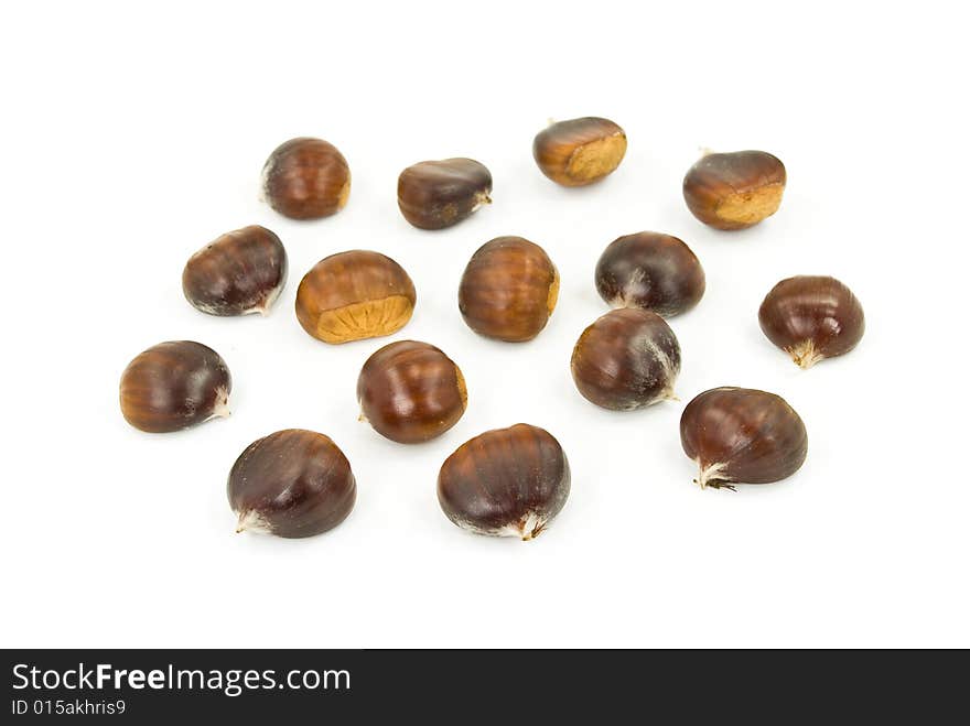 Many ripe chestnuts - isolated on white background