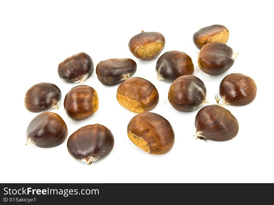 Many ripe chestnuts - isolated on white background