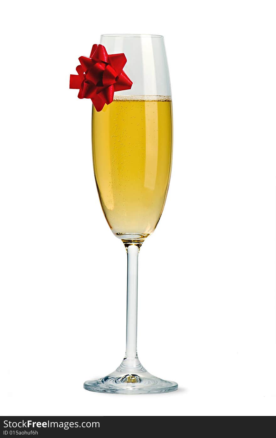 Isolated champagne flute with red ribbon bow. Isolated champagne flute with red ribbon bow