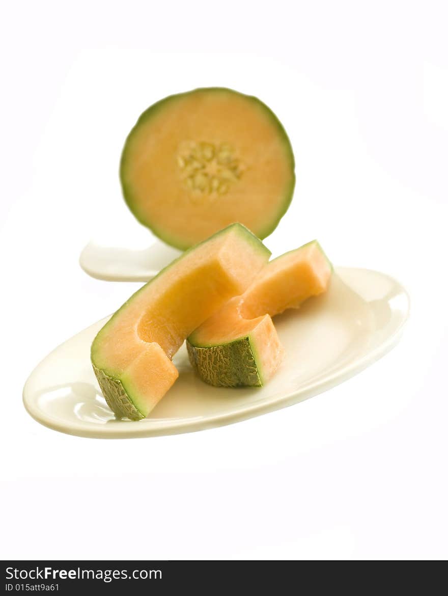 Delicious cantaloupe melon sliced on a plate.