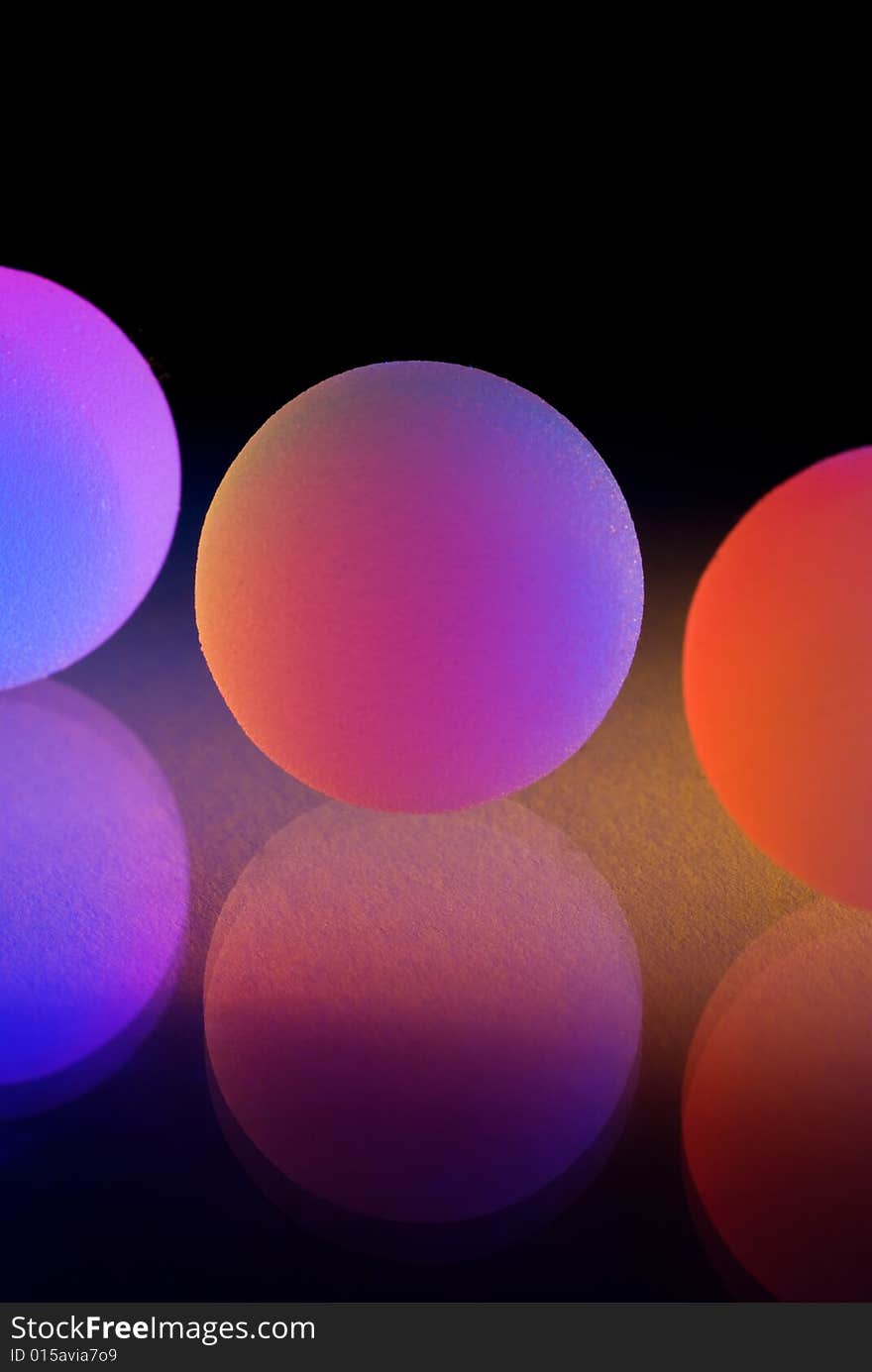 Stylish colorful balls with reflection. Isolated on black background