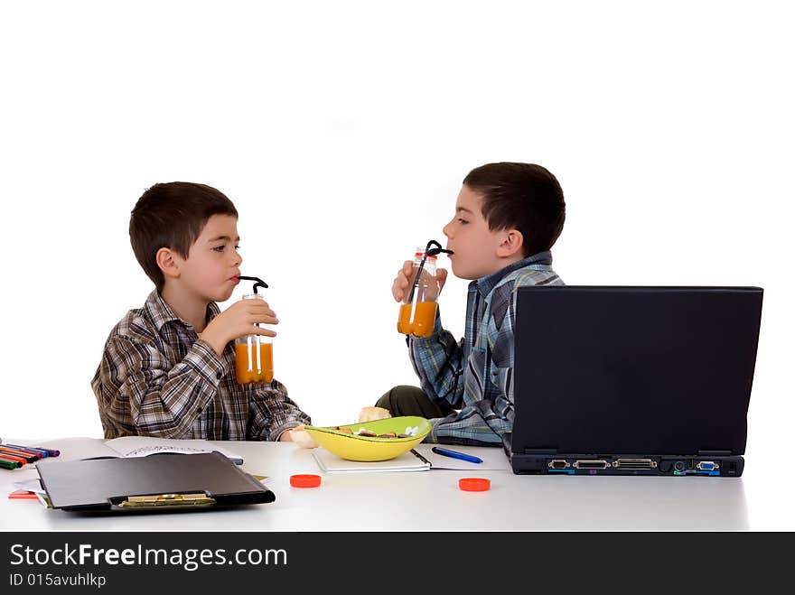 Two young boys doing together studying and homework. Two young boys doing together studying and homework