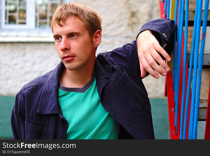 Young Stylish Man Stand Near Handrail.