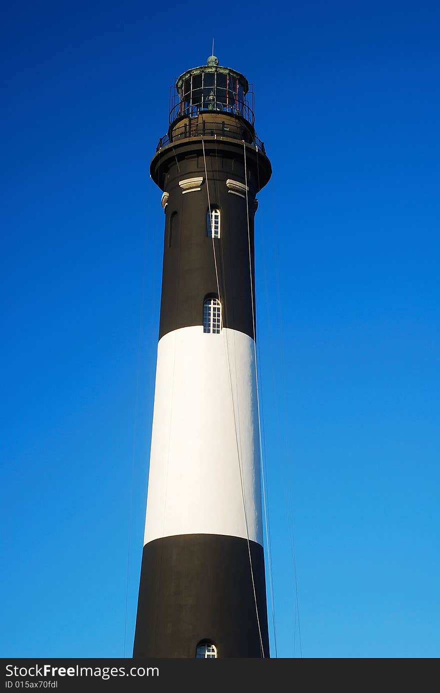 This is a shot of a lighthouse on Fire Island located off the coast of Long Island in New York state. This is a shot of a lighthouse on Fire Island located off the coast of Long Island in New York state.