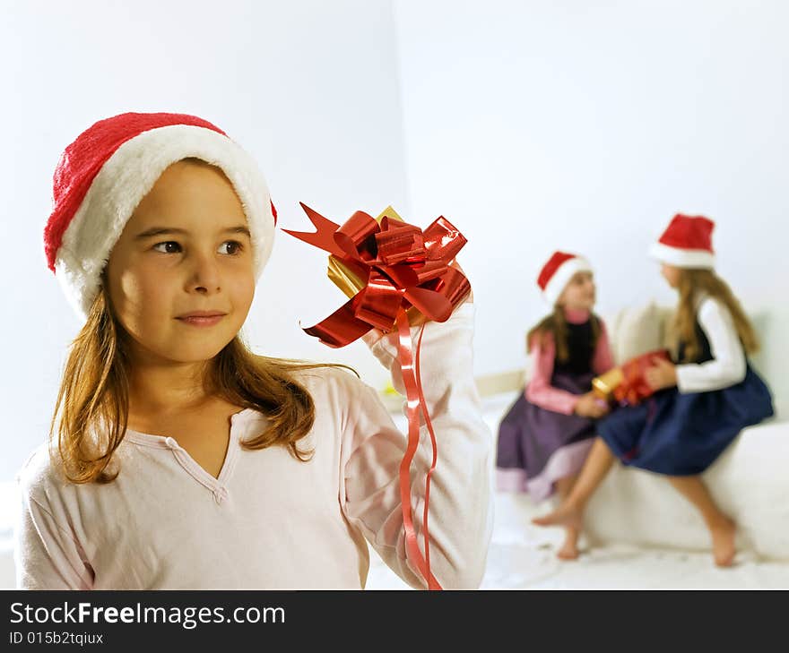 A little girl happy after receiving a present. A little girl happy after receiving a present