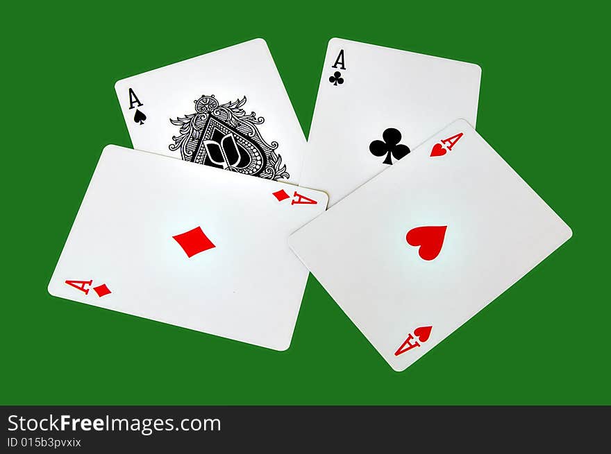 Four aces isolated in a green background with clipping path. Four aces isolated in a green background with clipping path