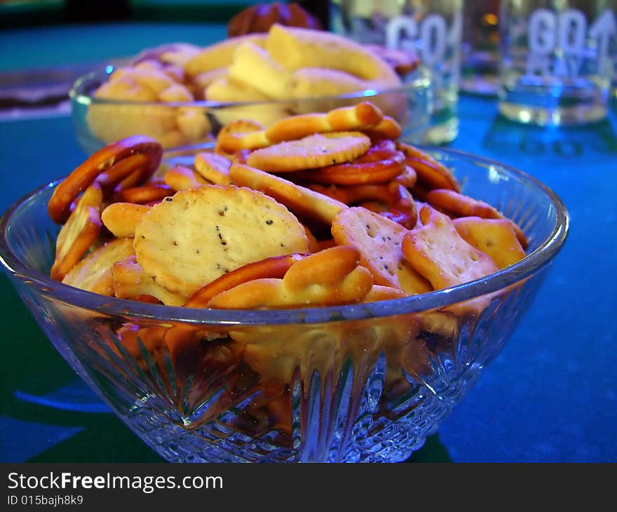 Macro photo of snacks  in bowl under blue light. Macro photo of snacks  in bowl under blue light