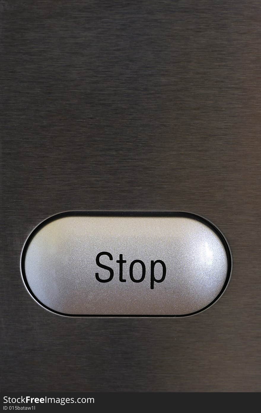 A stop button on a textured grey background. Space for text on the background.