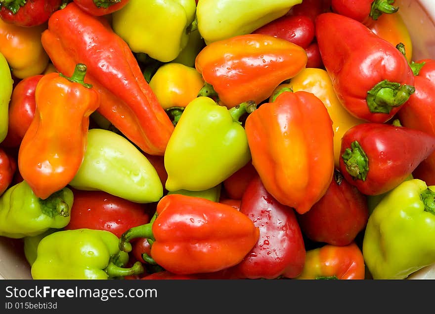 Background with many colored sweet peppers